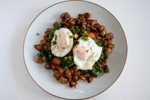 Kale and Egg Breakfast served on a bed of Hash Browns