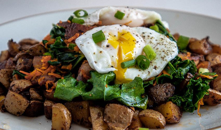 Kale and Egg Breakfast served on a bed of Hash Browns